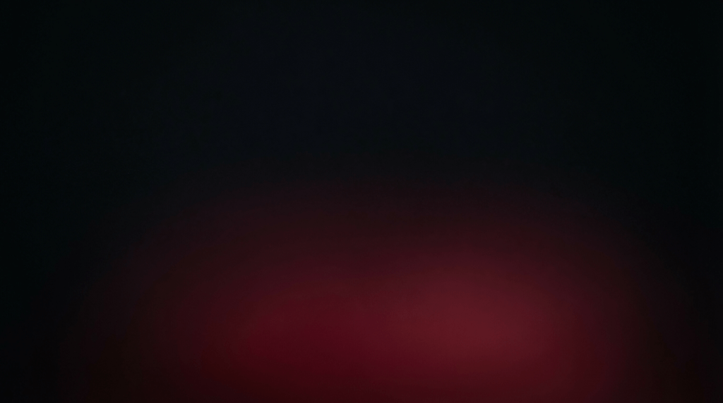 Subtle deep red glow at the bottom of a solid black background.